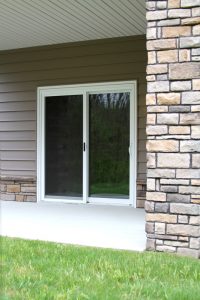 Exterios view of patio doors with a white frame