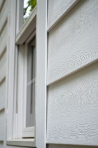 A close look of white composite siding on the house 