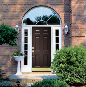 Exterior view of a brown steel entry door flanked by white sidelites
