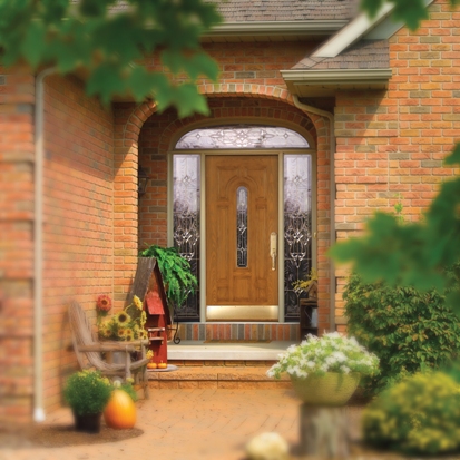 An elegant new entry door on a brick home