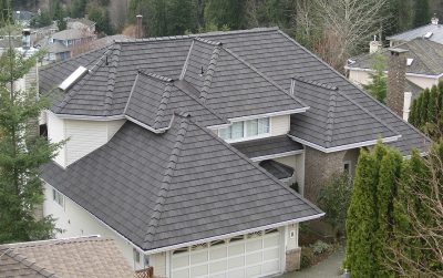 Aerial shot of a gray roof on a cream-colored house